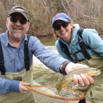 Moving on up in altitude to better clarity water. Good teamwork as dad puts a net on his little girls catch.